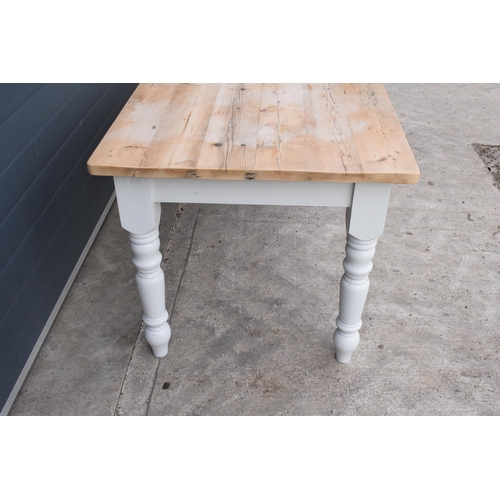 299 - A grand 8ft long 20th century pine topped farmhouse table sat on baluster legs. Painted with a vinta... 