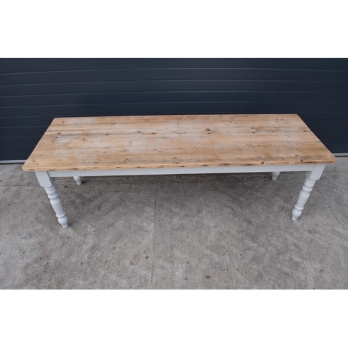 299 - A grand 8ft long 20th century pine topped farmhouse table sat on baluster legs. Painted with a vinta... 