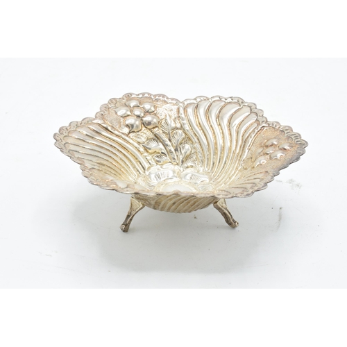 389A - A continental silver bon bon dish raised on three legs. 64.7 grams. 12cm diameter.