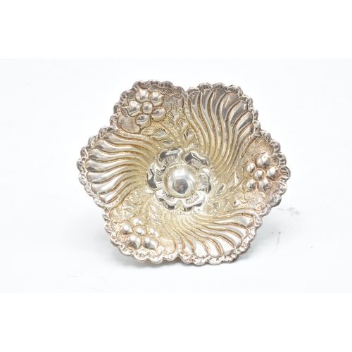 389A - A continental silver bon bon dish raised on three legs. 64.7 grams. 12cm diameter.