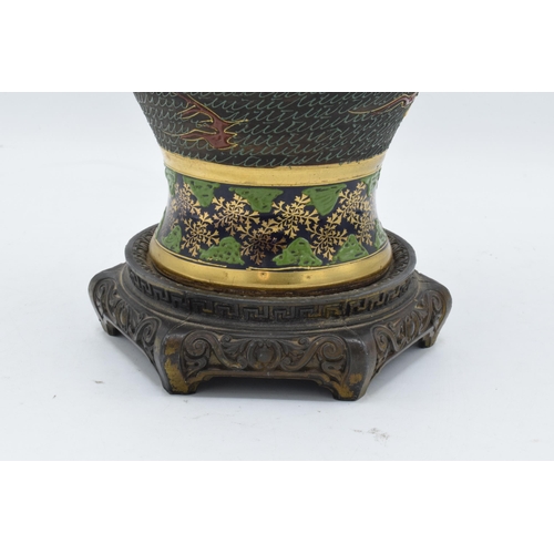 35A - A 20th century thick porcelain Japenese vase mounted onto an ornate metal base. 35cm tall. In good c... 