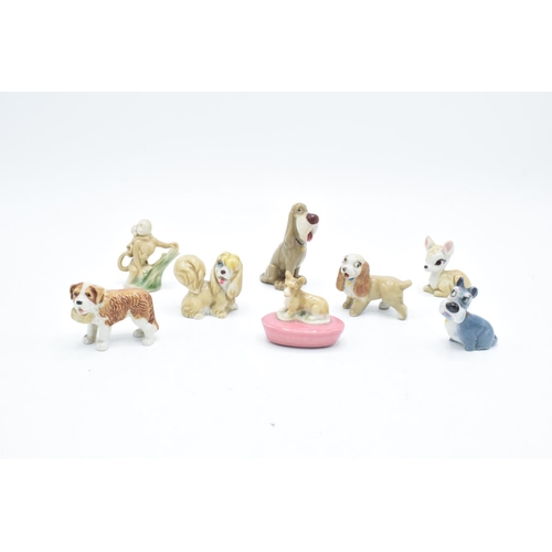 46 - A collection of Wade to include a corgi pen holder, dog with basket, 2 monkeys, Peg, Lady, Jock, Bam... 