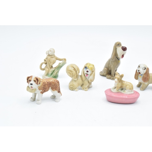 46 - A collection of Wade to include a corgi pen holder, dog with basket, 2 monkeys, Peg, Lady, Jock, Bam... 