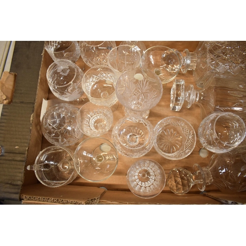 10J - A mixed collection of cut glass and crystal items to include 3 decanters, wine glasses, bowls etc. N... 