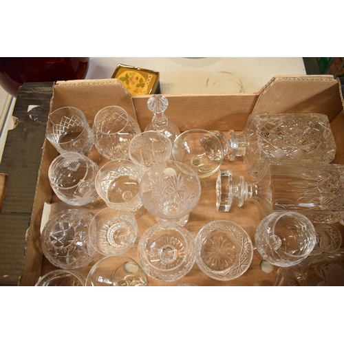 10J - A mixed collection of cut glass and crystal items to include 3 decanters, wine glasses, bowls etc. N... 