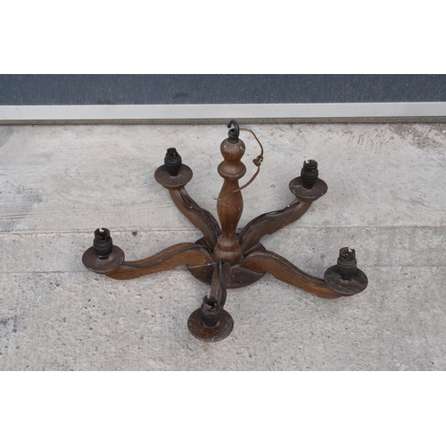 210D - An early to mid 20th century wooden light candelabra style fitting for 5 candles.