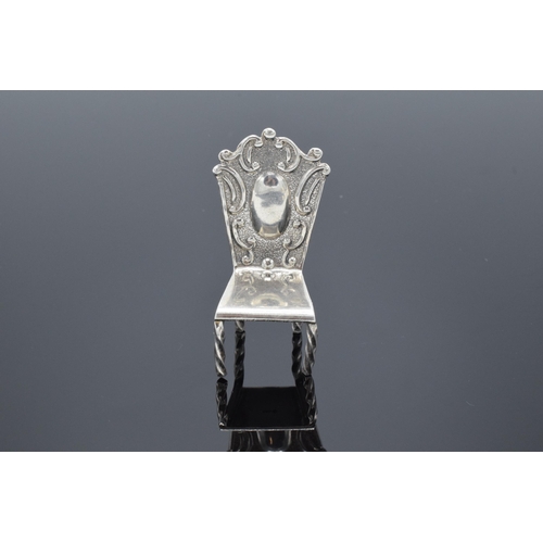 183 - Silver (925) miniature model of a hall chair. 10.8 grams. 5cm tall.