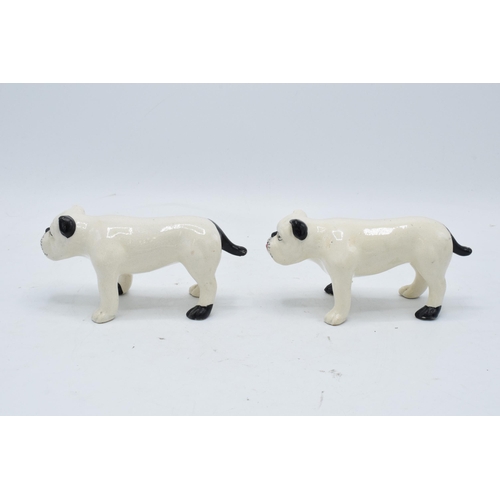 101 - A pair of 19th century pottery bulldogs standing square (2). In good condition with no obvious damag... 