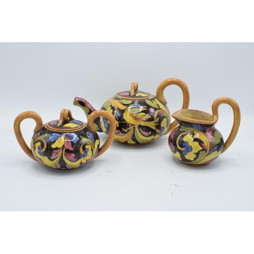 110 - An unusual tea set to consist of a teapot, milk jug and sugar bowl (3). Marked 'Mica 1272 Made Italy... 