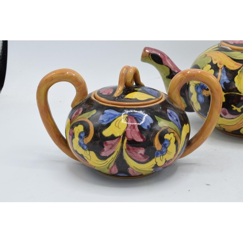 110 - An unusual tea set to consist of a teapot, milk jug and sugar bowl (3). Marked 'Mica 1272 Made Italy... 