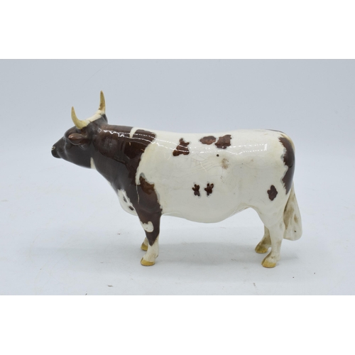 147 - Beswick Ayrshire Bull 1454B. In good condition with no obvious damage or restoration. With crazing a... 