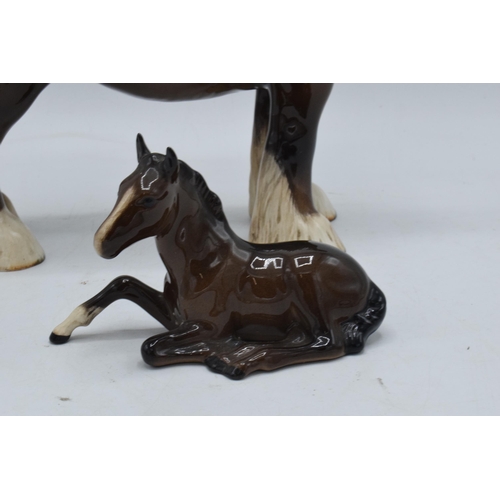 152 - Beswick brown shire 818 together with lying pony 915 (Doulton Backstamp) (2). In good condition with... 