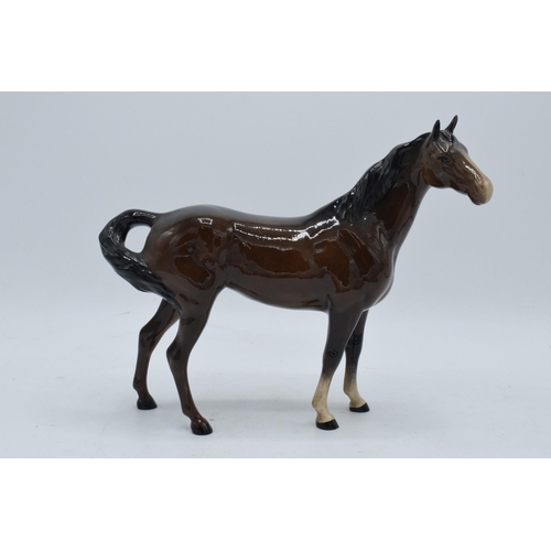 153 - Beswick brown swish tail horse 1182. In good condition with no obvious damage or restoration. 21cm t... 