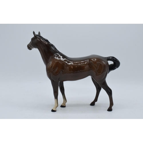 153 - Beswick brown swish tail horse 1182. In good condition with no obvious damage or restoration. 21cm t... 