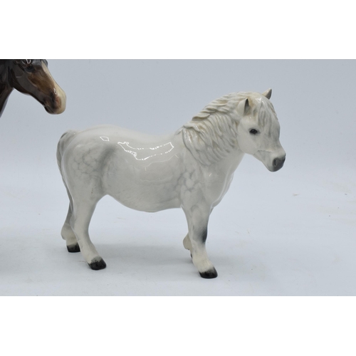 154 - Beswick Brown Huntsman's Horse 1484 together with Royal Doulton dapple grey Shetland pony (2). In go... 