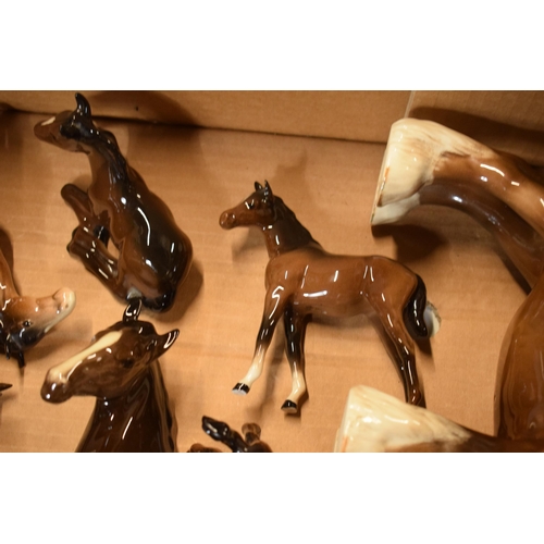 172 - A collection of Beswick animals to include a doe, 818 shire, 1197 head up pony, lying foal etc (some... 