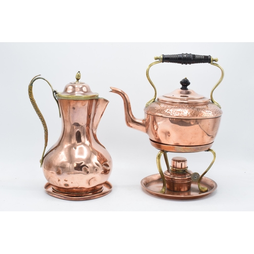 204 - A Henry Loveridge arts and crafts hammered copper spirit kettle on a stand together with a copper co... 