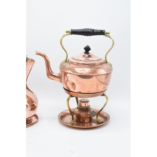 204 - A Henry Loveridge arts and crafts hammered copper spirit kettle on a stand together with a copper co... 