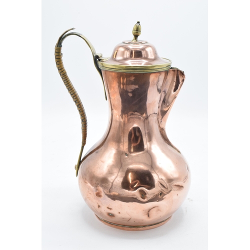 204 - A Henry Loveridge arts and crafts hammered copper spirit kettle on a stand together with a copper co... 