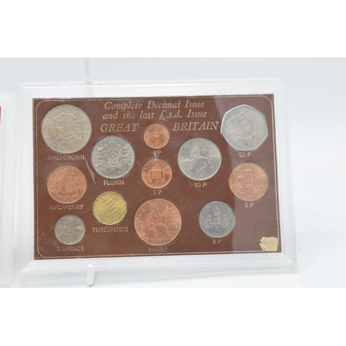 209 - A pair of cased coin sets to include Farwell to the £.S.D System and the Complete Decimal Issue and ... 