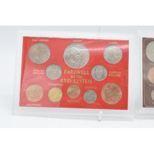 209 - A pair of cased coin sets to include Farwell to the £.S.D System and the Complete Decimal Issue and ... 