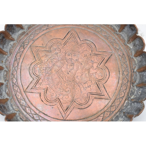 212 - 19th century Middle Eastern Islamic Persian copper tray with engravings depicting a man amongst foli... 