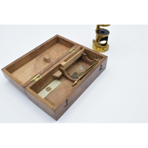 216 - A pair of items to include a late 19th / early 20th century drum microscope (14cm tall) in a fitted ... 