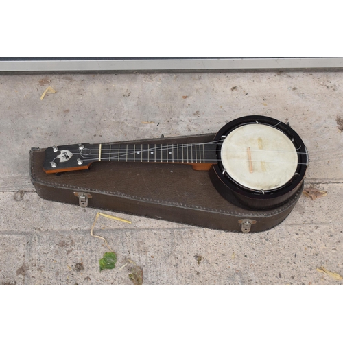 223 - A vintage cased Keech Banjolele Banjo. Will need re-stringing / some attention.