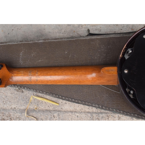 223 - A vintage cased Keech Banjolele Banjo. Will need re-stringing / some attention.