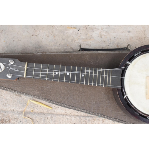 223 - A vintage cased Keech Banjolele Banjo. Will need re-stringing / some attention.