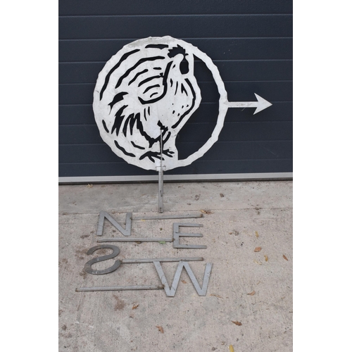 226 - A large stainless steel plasma cut weathervane in the form of a cockerel with letters N E S W on met... 