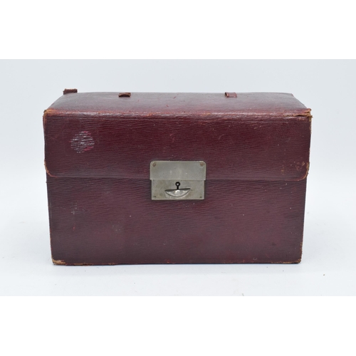 229 - An early 20th century travelling vanity set in a leather carry case