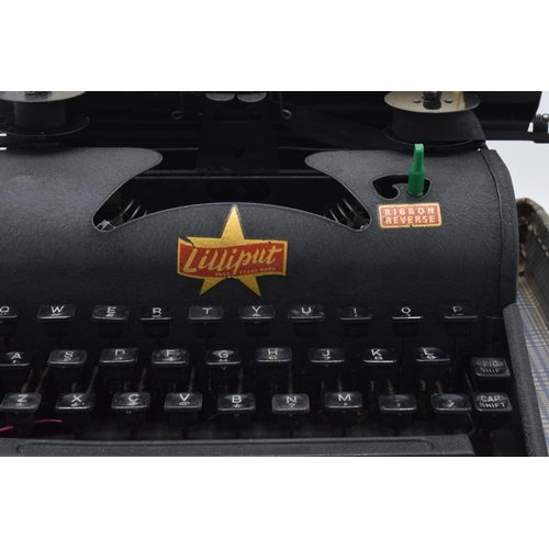 230 - Lilliput cased typewriter with original instructions. Appears in good condition though untested. Fro... 