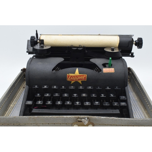 230 - Lilliput cased typewriter with original instructions. Appears in good condition though untested. Fro... 