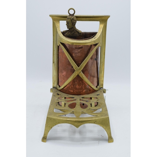 240 - An early 20th century brass and copper fireside trivet / companion set holder. 28cm tall.