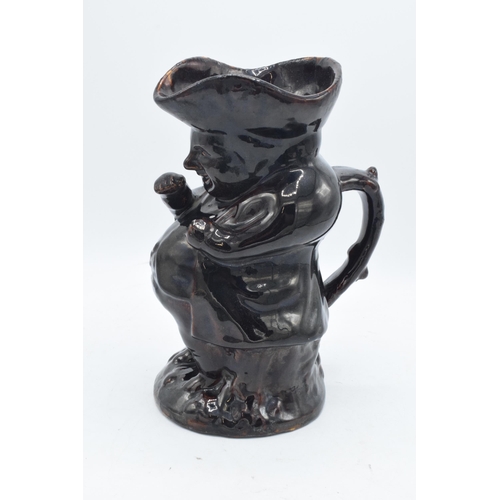 25 - A 19th century treacle glaze or similar Toby jug together with a selection of silver plated spoons e... 
