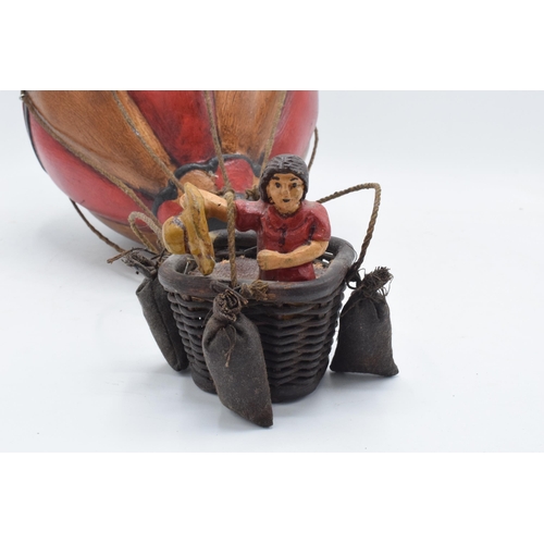 262 - A painted hanging model of a hot air balloon group, the red and white balloon above a wicker basket ... 