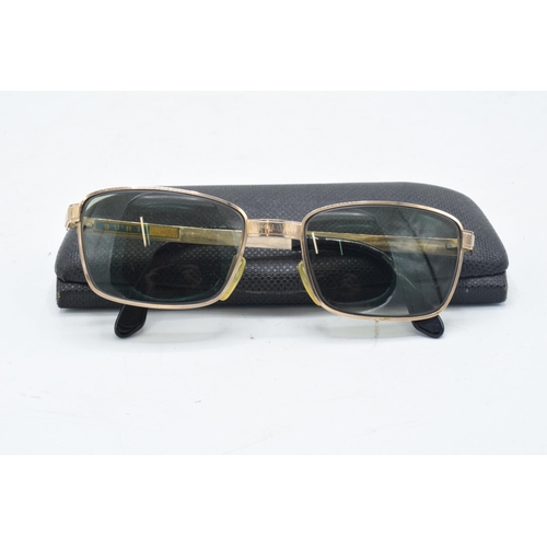 265 - A pair of Viennaline gold plated vintage sunglasses fitted with prescription lenses in case.