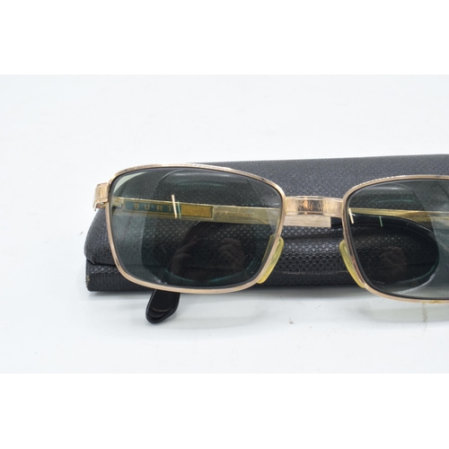 265 - A pair of Viennaline gold plated vintage sunglasses fitted with prescription lenses in case.