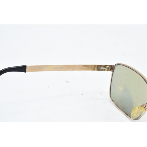 265 - A pair of Viennaline gold plated vintage sunglasses fitted with prescription lenses in case.