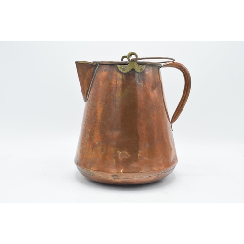 270 - An unusual 19th century copper jug / pouring vessel with brass mounts. 24cm tall.