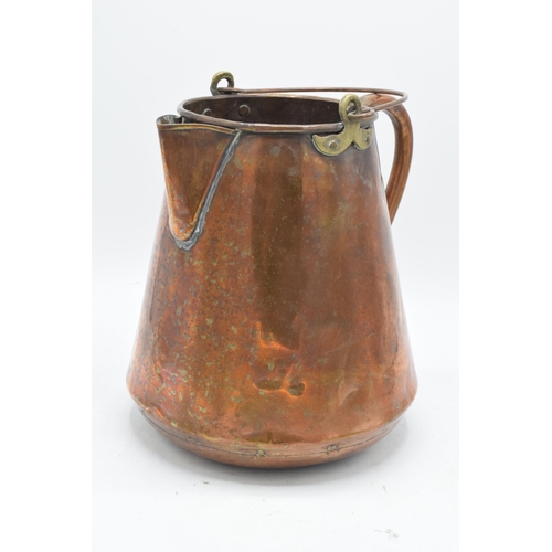 270 - An unusual 19th century copper jug / pouring vessel with brass mounts. 24cm tall.