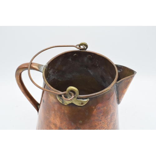 270 - An unusual 19th century copper jug / pouring vessel with brass mounts. 24cm tall.