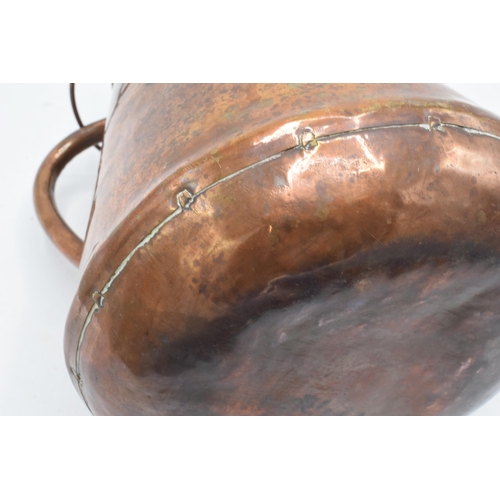 270 - An unusual 19th century copper jug / pouring vessel with brass mounts. 24cm tall.