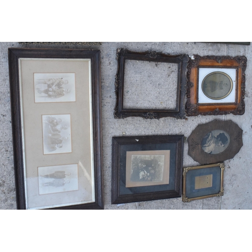 284 - A good collection of 19th and 20th century photo frames with subjects to include carved wooden examp... 