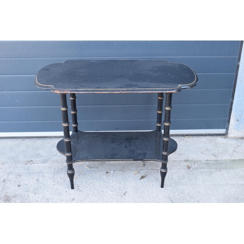 286 - An early 20th century ebonised side table with brass beading. 92 x 48 x 70cm. In good functional con... 