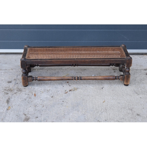 289 - An early 20th century oak and rattan effect long foot stool made by Lee Longland. 91 x 30 x 27cm. In... 