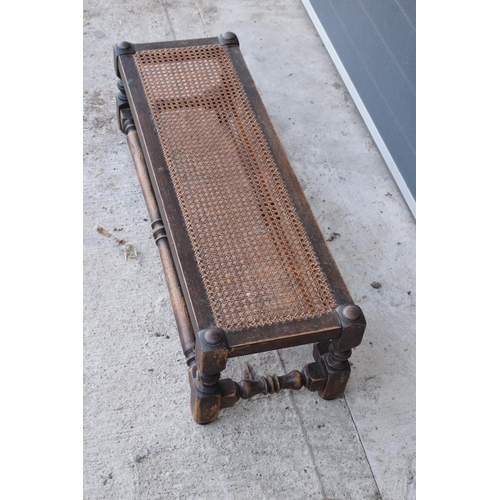 289 - An early 20th century oak and rattan effect long foot stool made by Lee Longland. 91 x 30 x 27cm. In... 