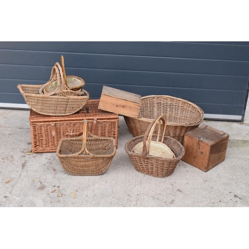 291 - A collection of vintage wicker baskets and wooden boxes of various forms