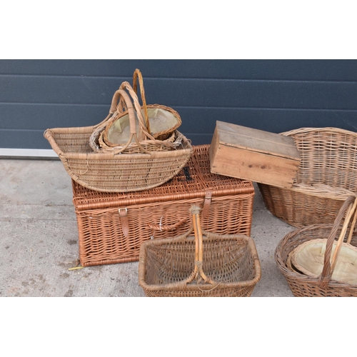 291 - A collection of vintage wicker baskets and wooden boxes of various forms